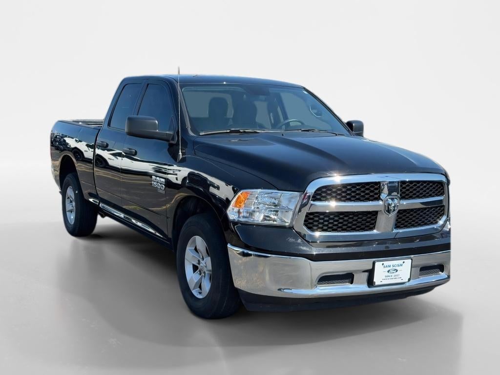 2024 RAM 1500 Classic SLT in Diamond Black Crystal Pearlcoat — front three-quarter view