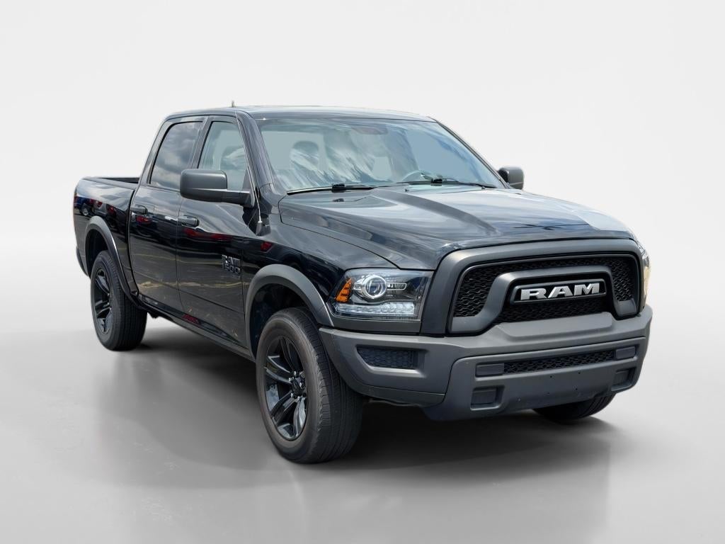2024 RAM 1500 Classic Warlock in Diamond Black Crystal Pearlcoat — front three-quarter view