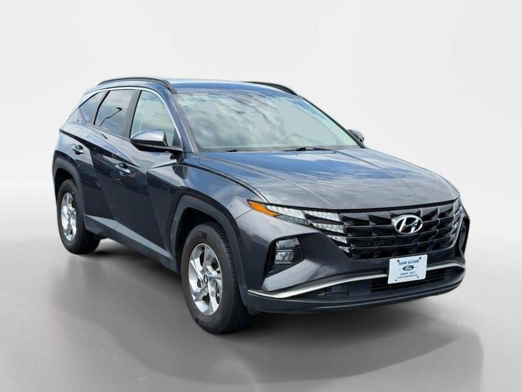 2024 Hyundai Tucson SEL in Dark Gray Metallic — front three-quarter view